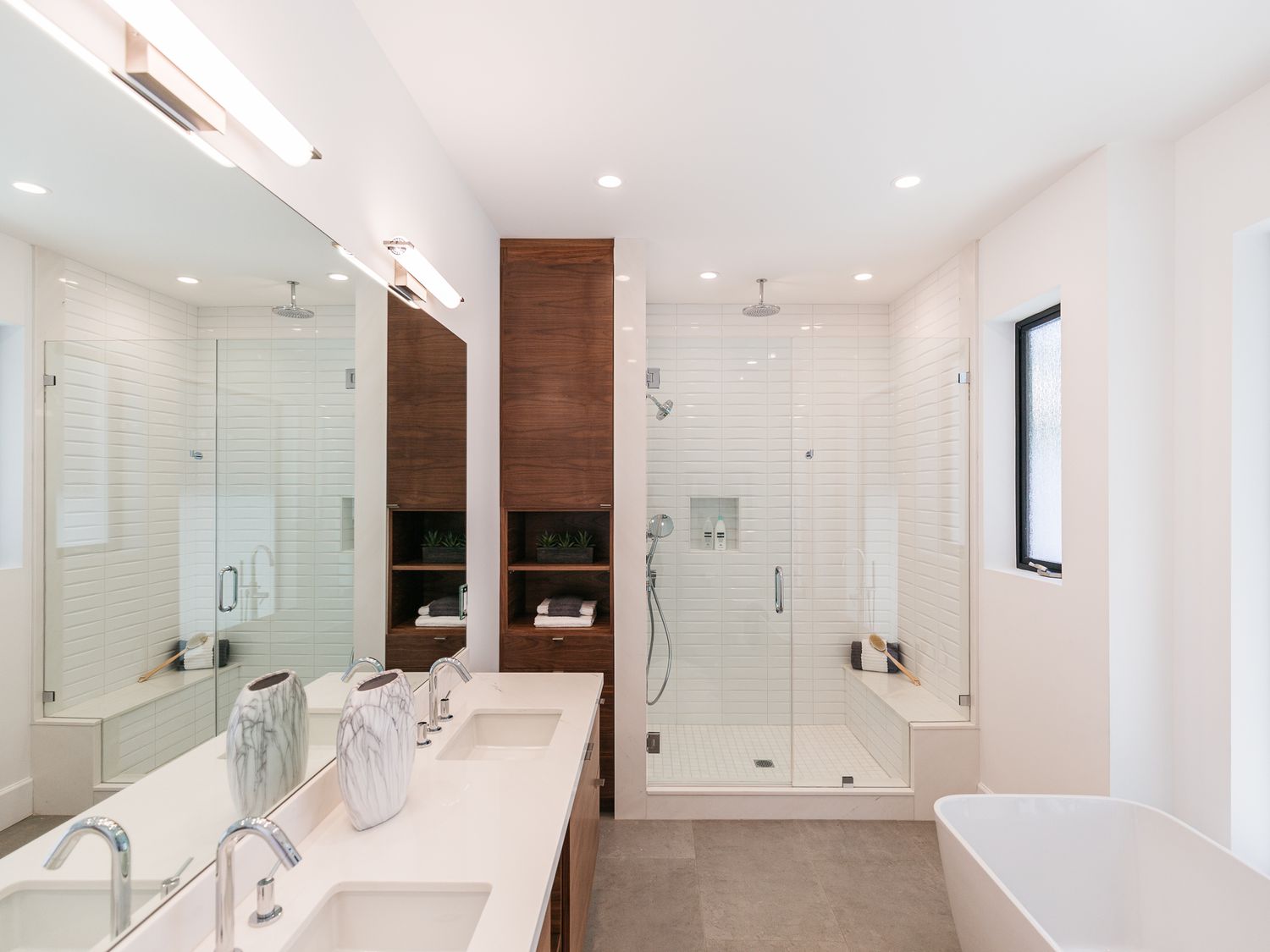 frameless pivot shower doors in a modern bathroom | ACE DECOR