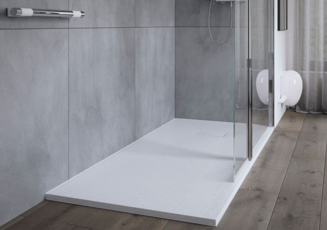 Sleek modern bathroom with textured surface highlighting durable walk-in shower base sizes.