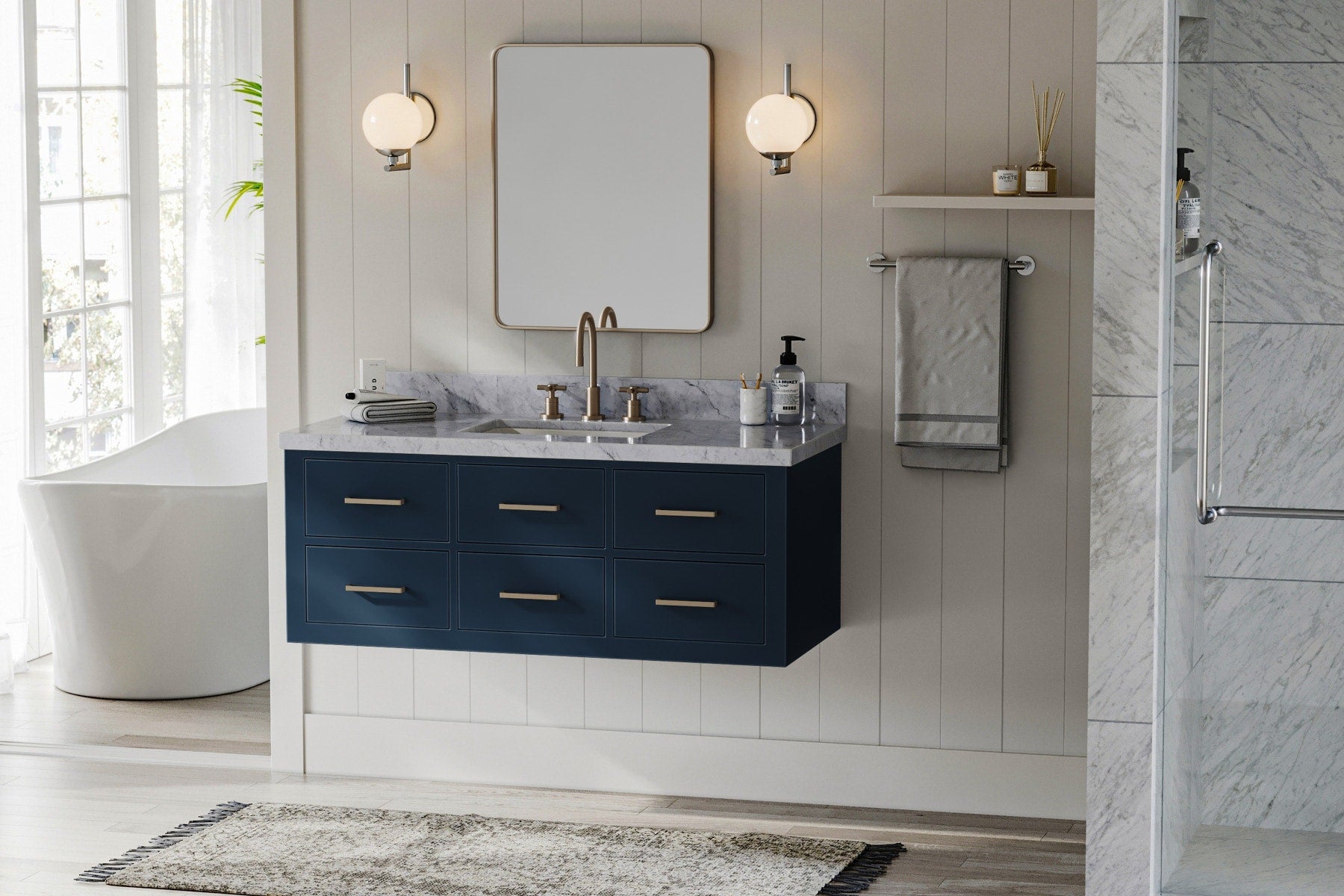 Deep blue floating bathroom vanity with sink featuring marble top and gold fixtures