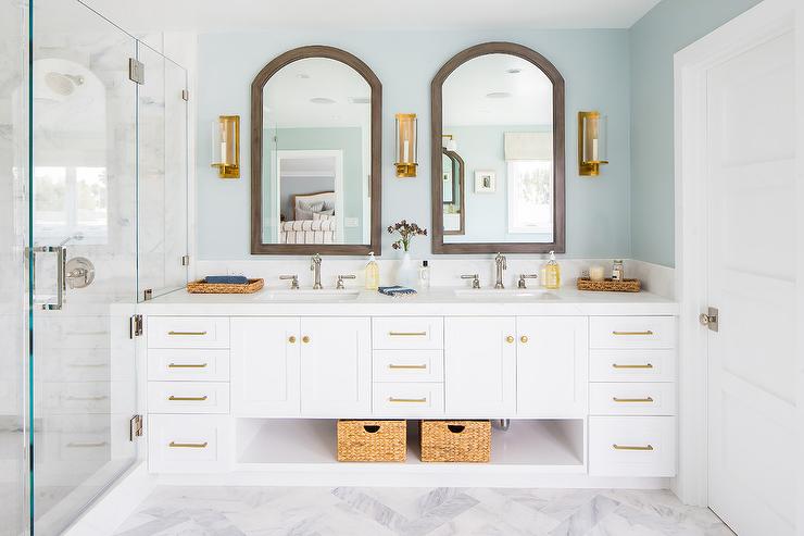 Wood mirrors for bathrooms with elegant wooden frames and stylish lighting in a modern bathroom setting.