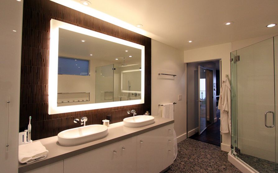 Elegant bathroom mirrors and lighting with a wide frameless LED mirror for double vanities