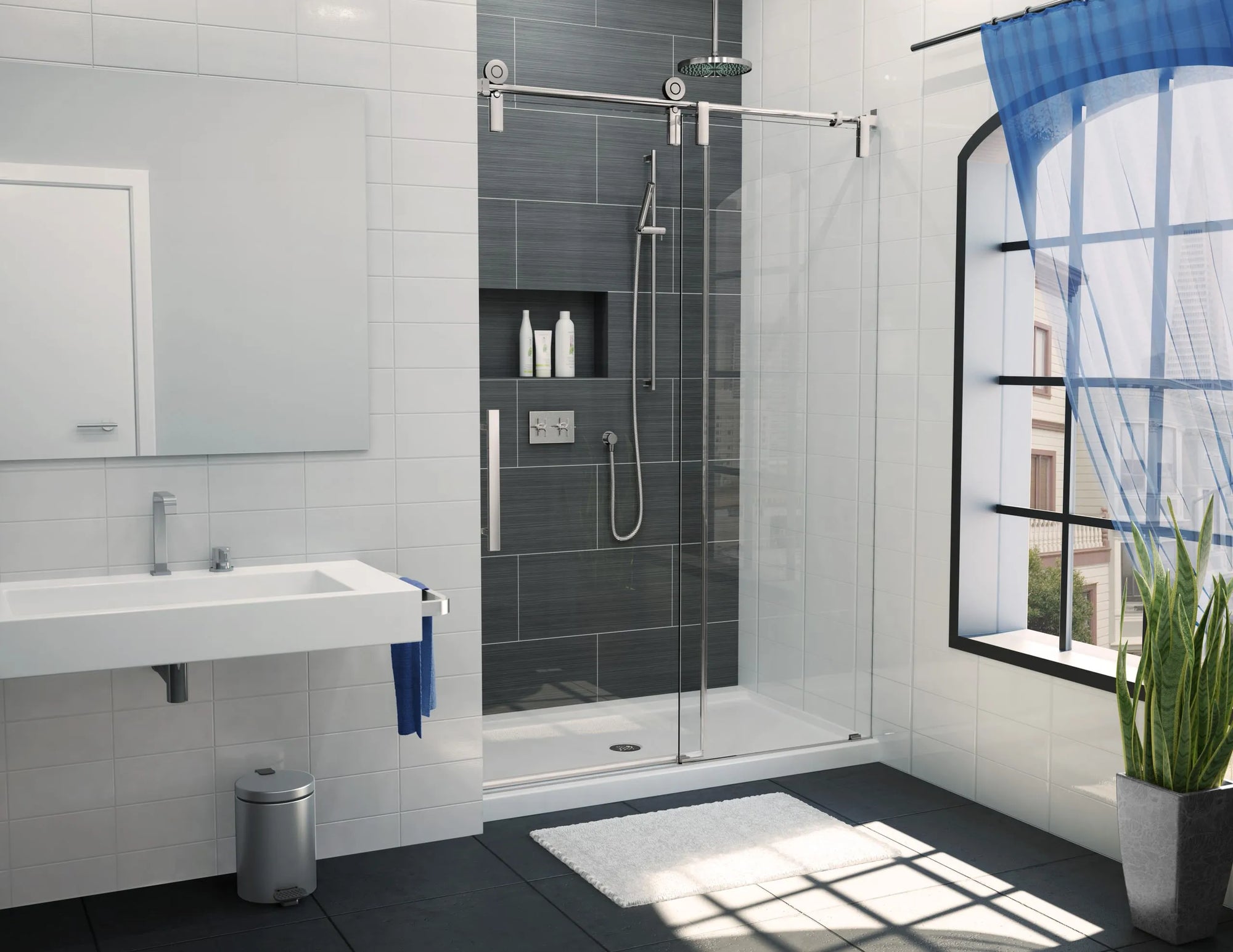  Modern bathroom with sliding frameless shower door, dark-tiled shower walls, window, and natural light in clean design.