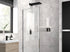 Modern bathroom with hinged glass shower doors and panels paired with matte black hardware.