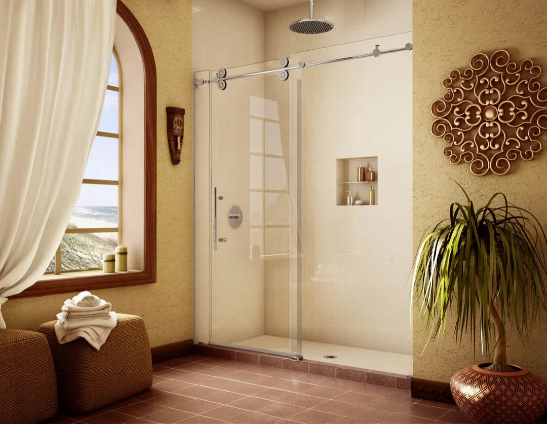 Frameless sliding shower door in modern bathroom with beige walls and terracotta floor, highlighted by natural light.