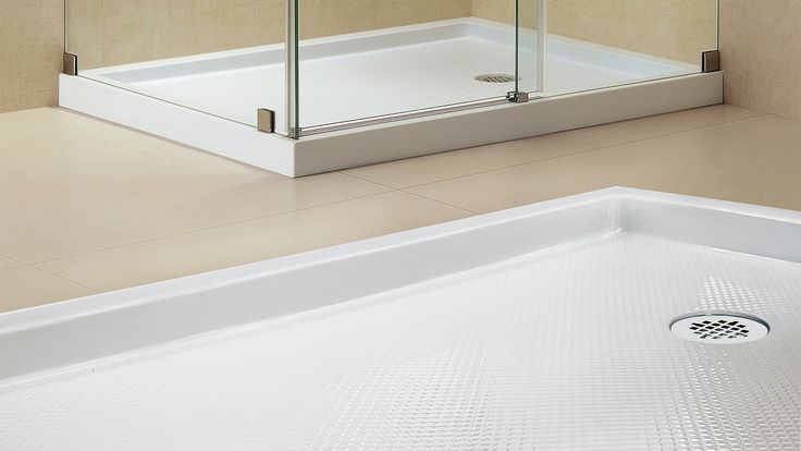 Close-up of anti-slip surface on pre made shower base with corner drain