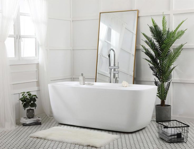 Elegant bathroom featuring a freestanding bathtub and a modern bathtub shower faucet combo.