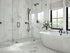 Tile on shower base with marble-look walls and a freestanding bathtub