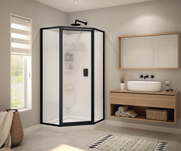 Modern black-framed walk in shower enclosure with clear glass panels in a contemporary bathroom