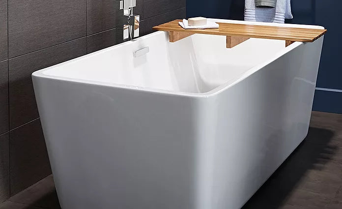 Modern square freestanding bathtub designed to align with standard tub height for comfortable daily use.