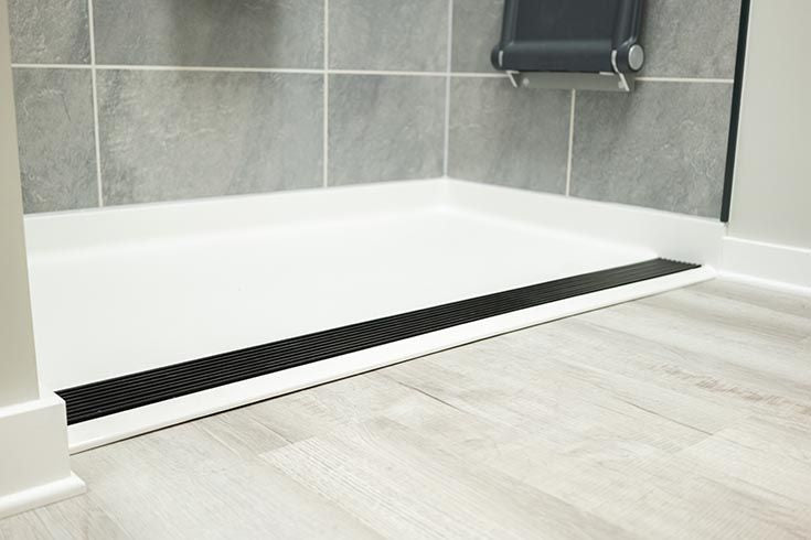 Accessible shower base ideas featuring barrier-free entry with anti-slip edge design.