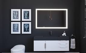 Modern 30 x 36 bathroom mirror with LED lighting above a sleek black bathroom vanity
