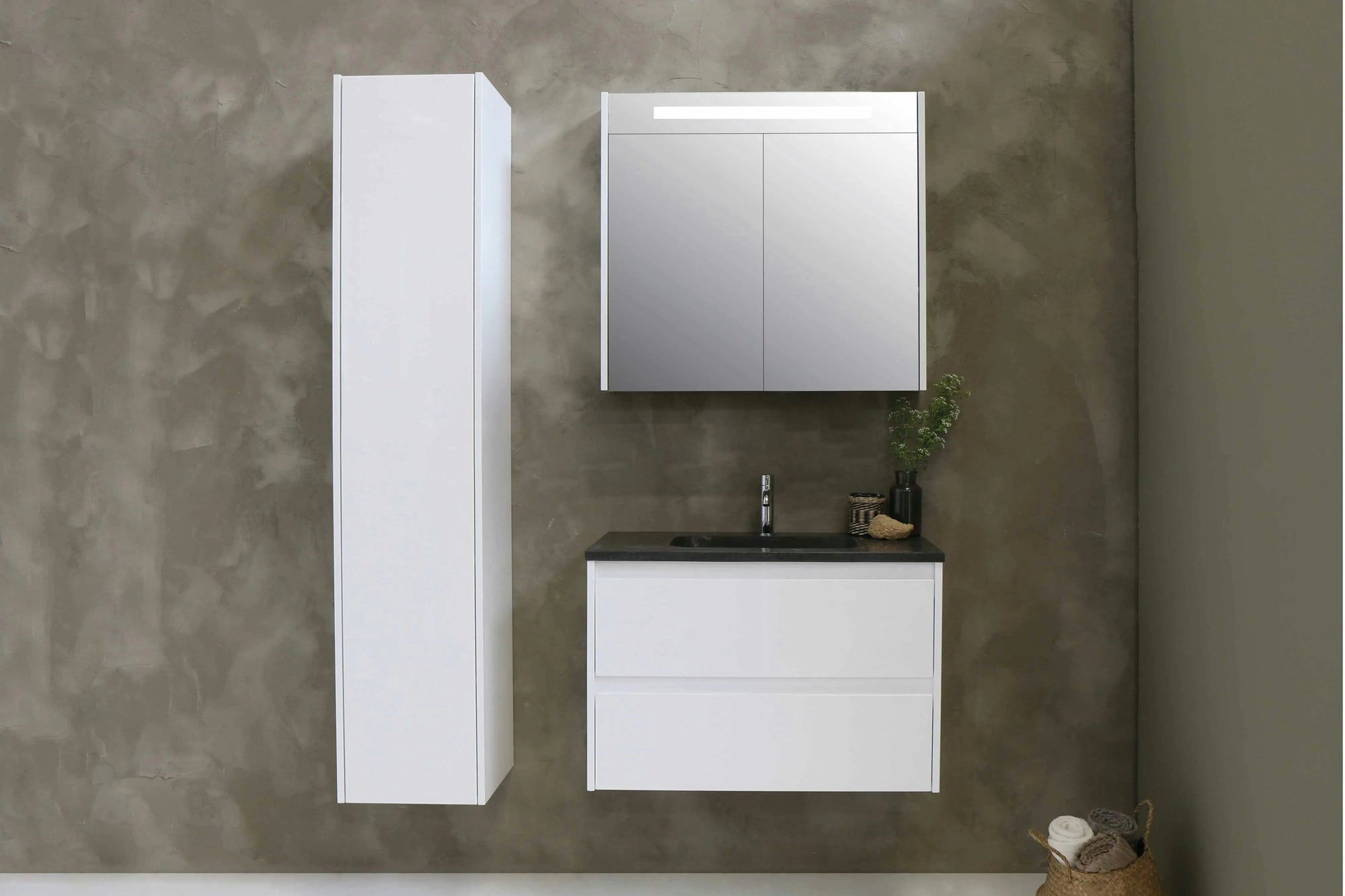 Modern bathroom medicine cabinet with mirror and integrated lighting above a minimalist white vanity.