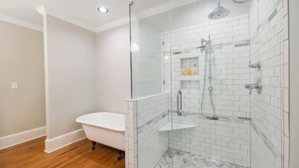 Modern bathroom with a spacious shower and a glass sliding door for shower.