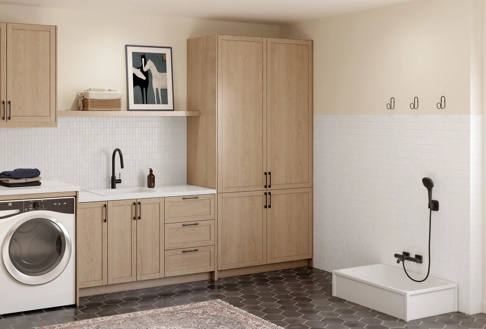Spacious laundry room with wood cabinets and a white deep laundry room sink designed for efficiency