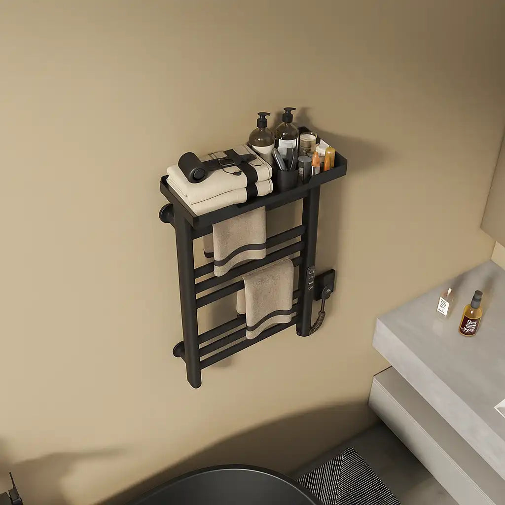 Top view of black Thervon Series towel warmer nearby vanity, 18 x 27 size with shelf holding towels and toiletries | Ace Decor