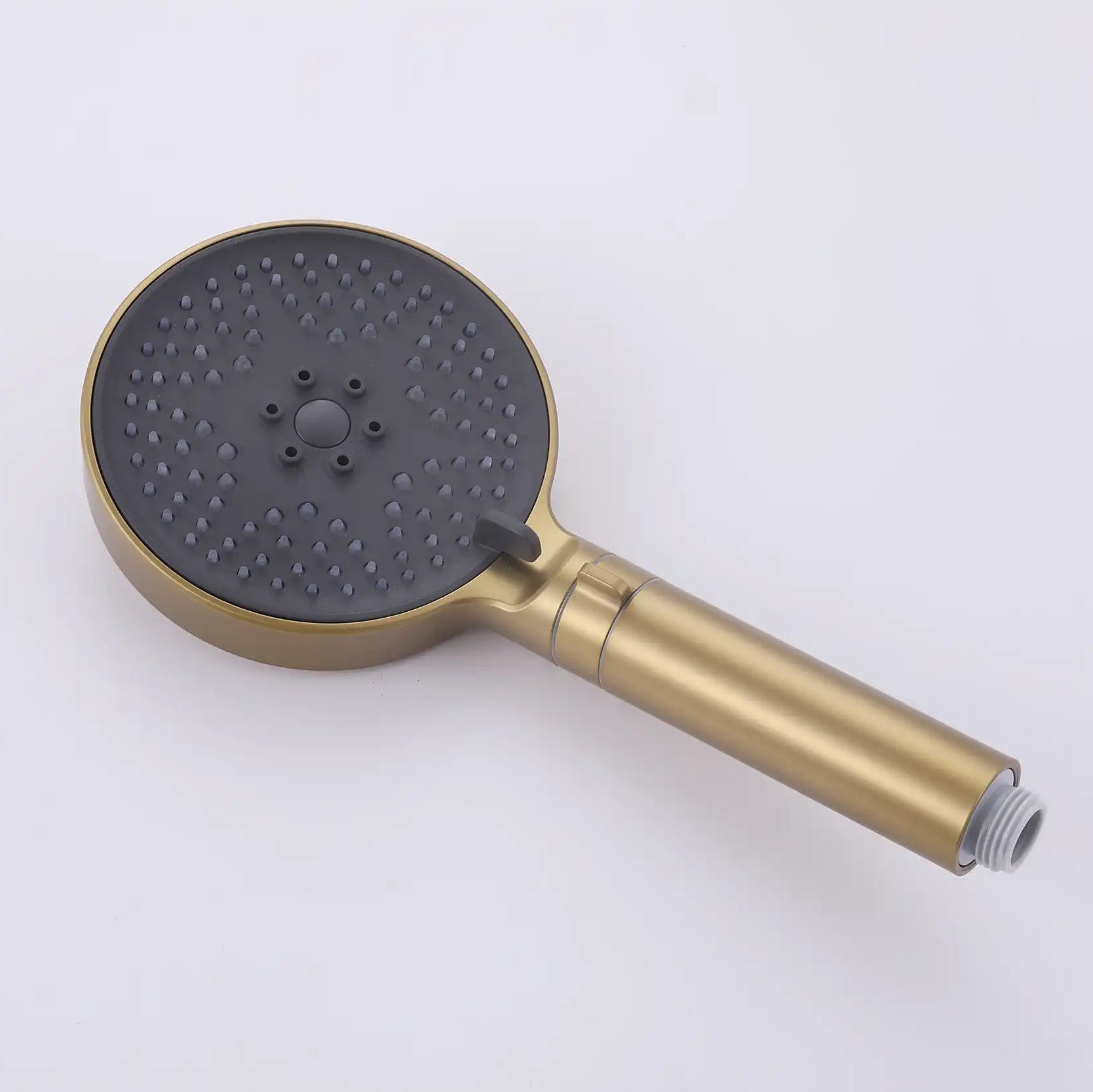 Front view of the brushed gold handheld shower head.