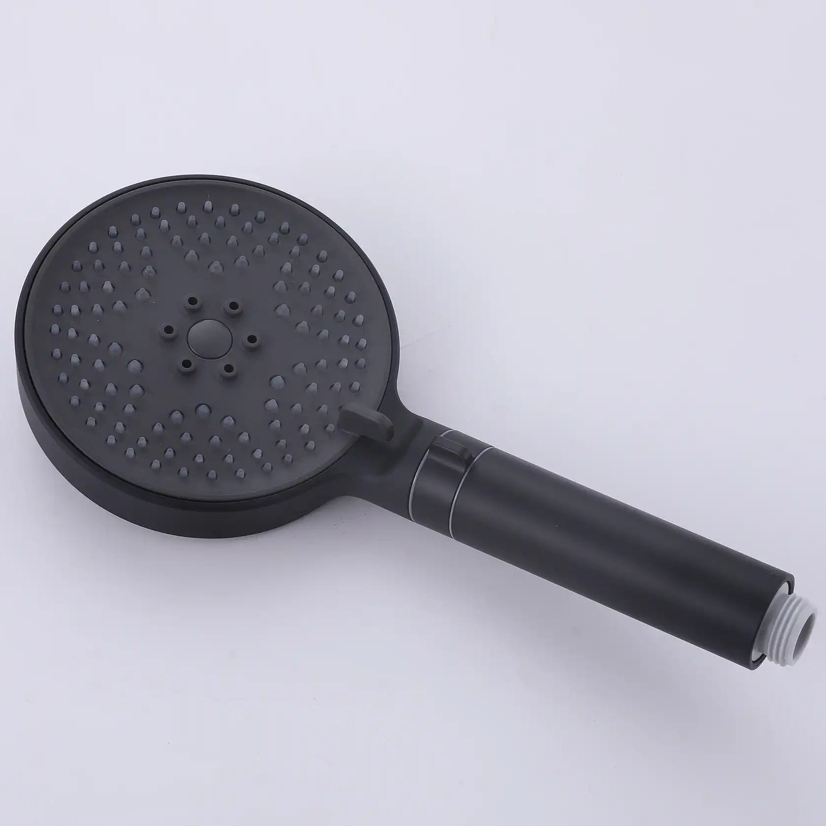 Front view of the matte black handheld shower head with a dark spray face and silicone nozzles.