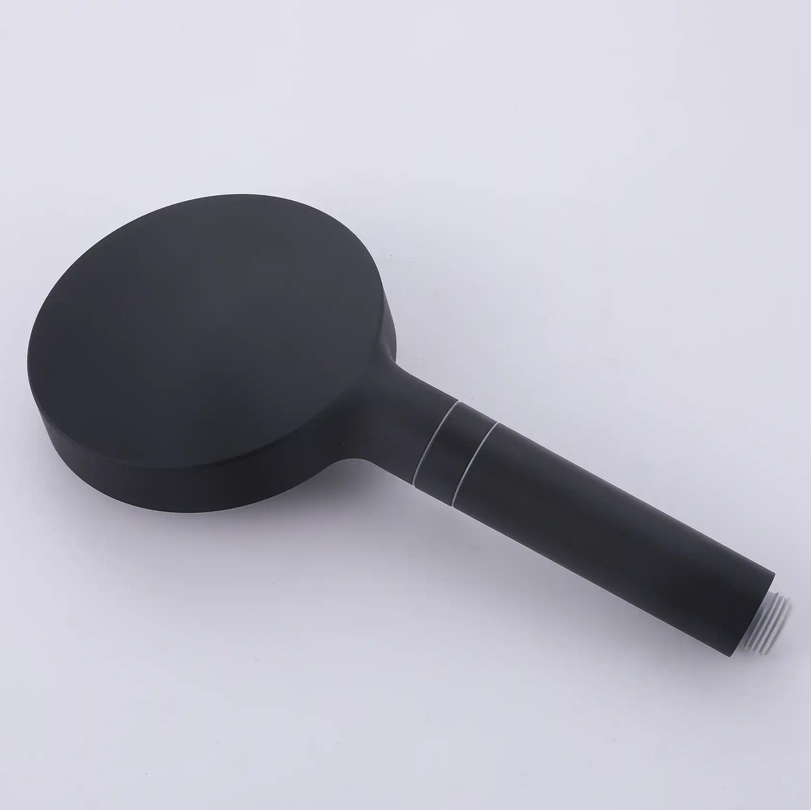 Rear view of the matte black handheld shower head highlighting its smooth, streamlined handle.