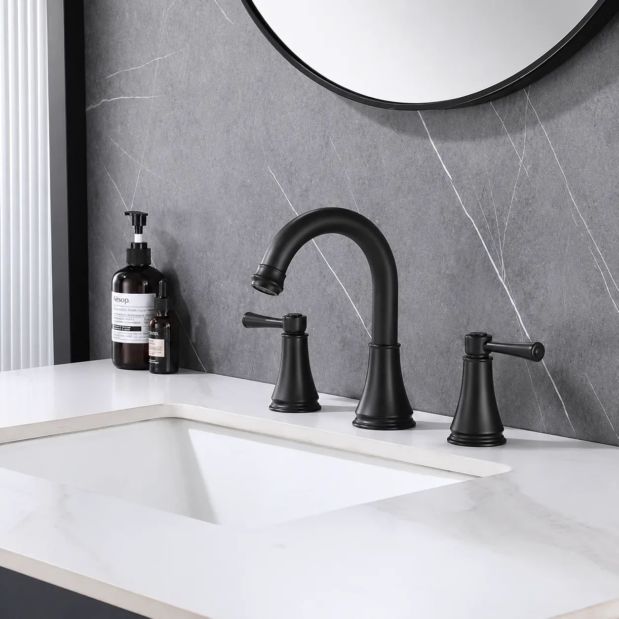 VALMIRA Matte Black Sink Faucet installed on modern bathroom vanity.