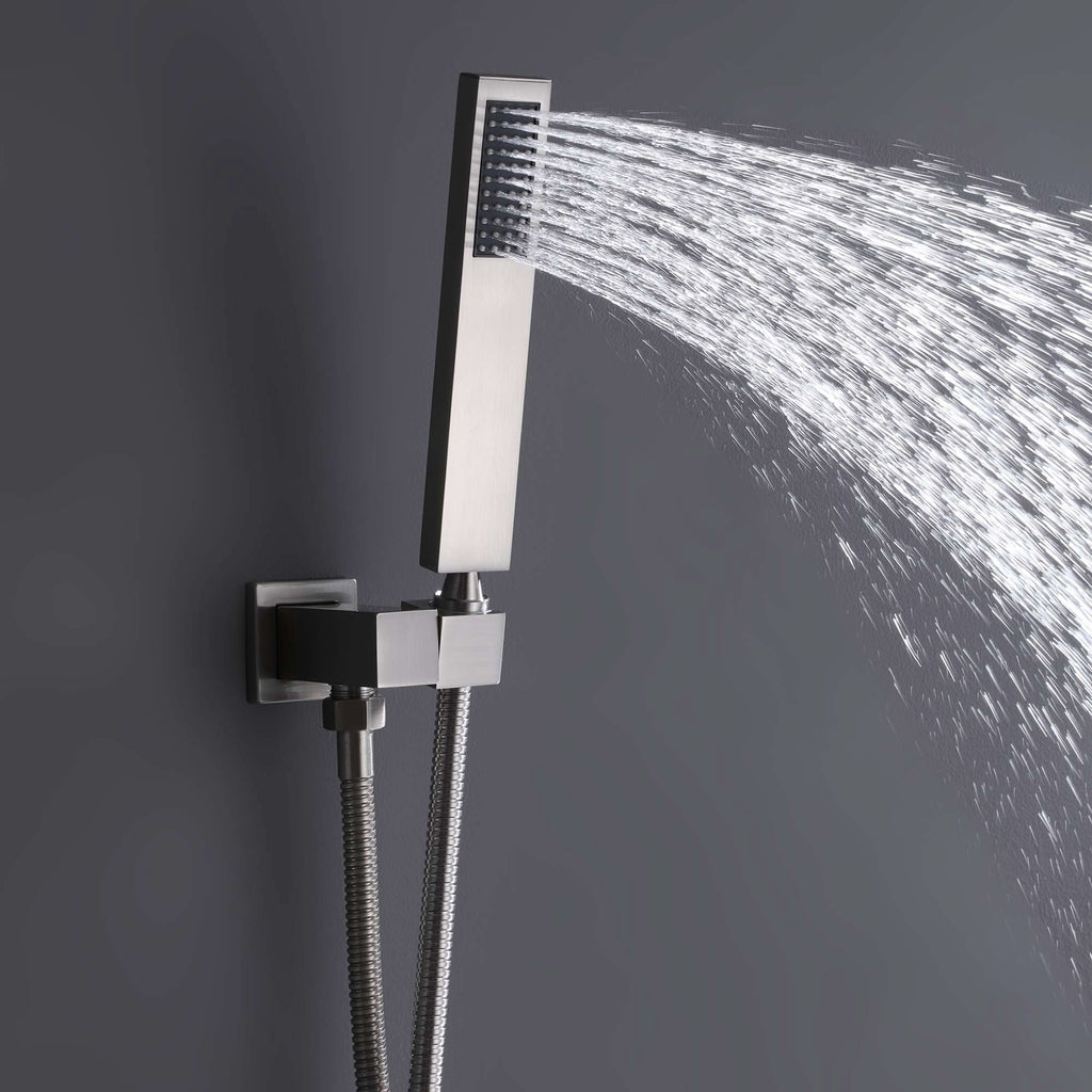 Brushed nickel handheld shower head spraying water with adjustable wall mount