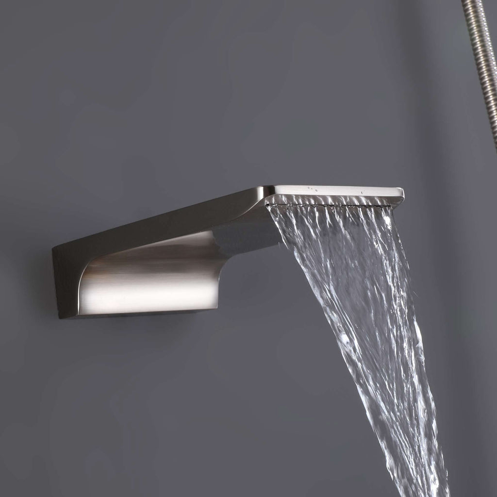 Brushed nickel waterfall tub spout releasing a smooth, steady water stream