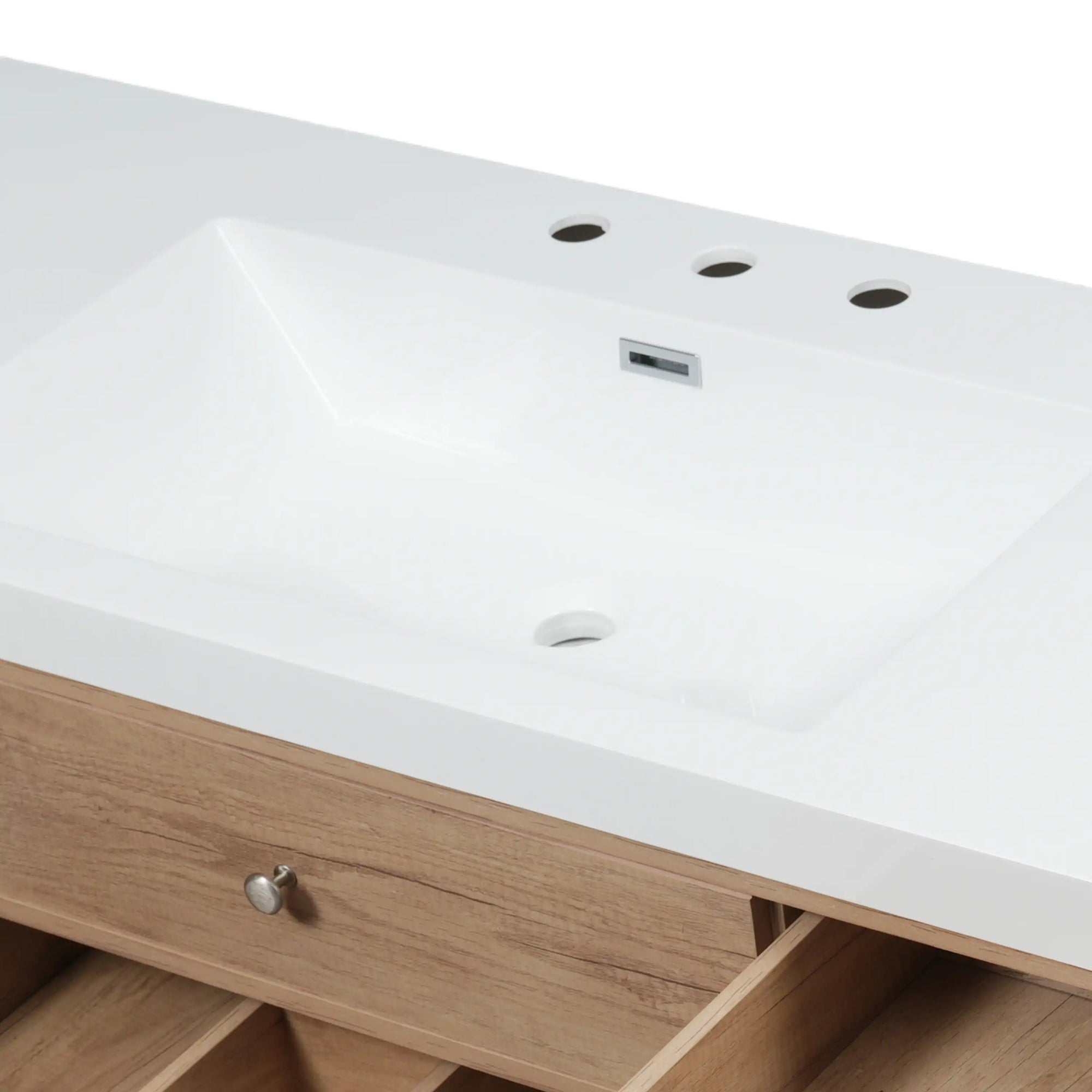 Close-up of SMC bathroom sink with white countertop and natural wood vanity drawer | Ace Decor