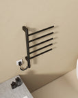 16 x 27 black heated towel rack viewed from above, mounted near a modern bathtub | Ace Decor