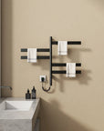 Velin Series 18 x 27 black electric towel warmer for bathroom mounted near sink with towels displayed on rotating bars | Ace Decor