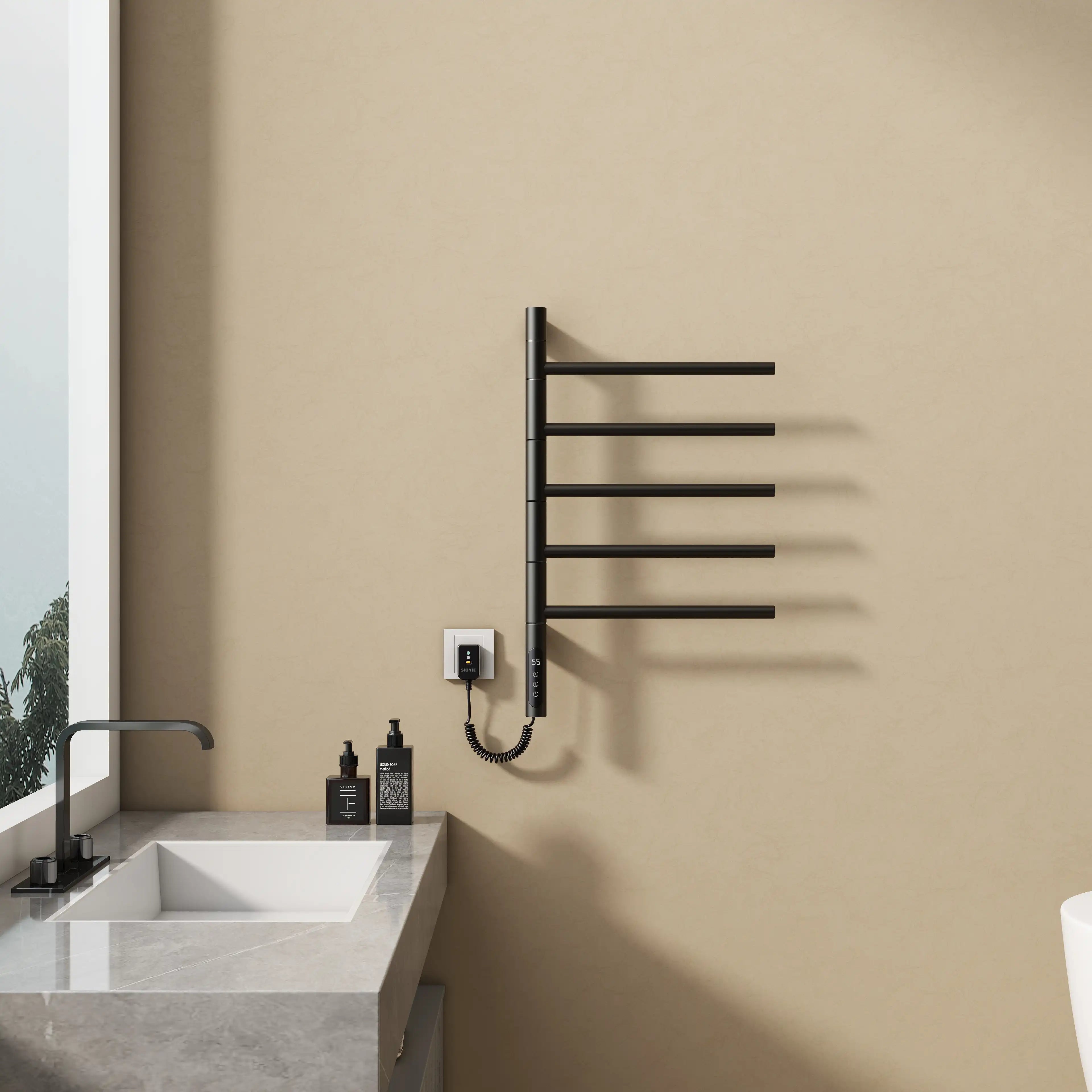 16 x 27 black heated towel rack wall-mounted next to a vanity in a minimalist bathroom | Ace Decor