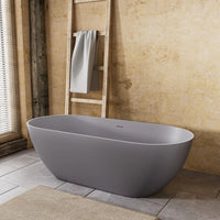 Nectar Series 63-inch matte gray freestanding bathtub in a modern bathroom with tile floor, textured wall, and natural light.