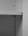 Adjustable storage shelf detail inside a gray bathroom vanity, offering flexible organization for everyday essentials | Ace Decor