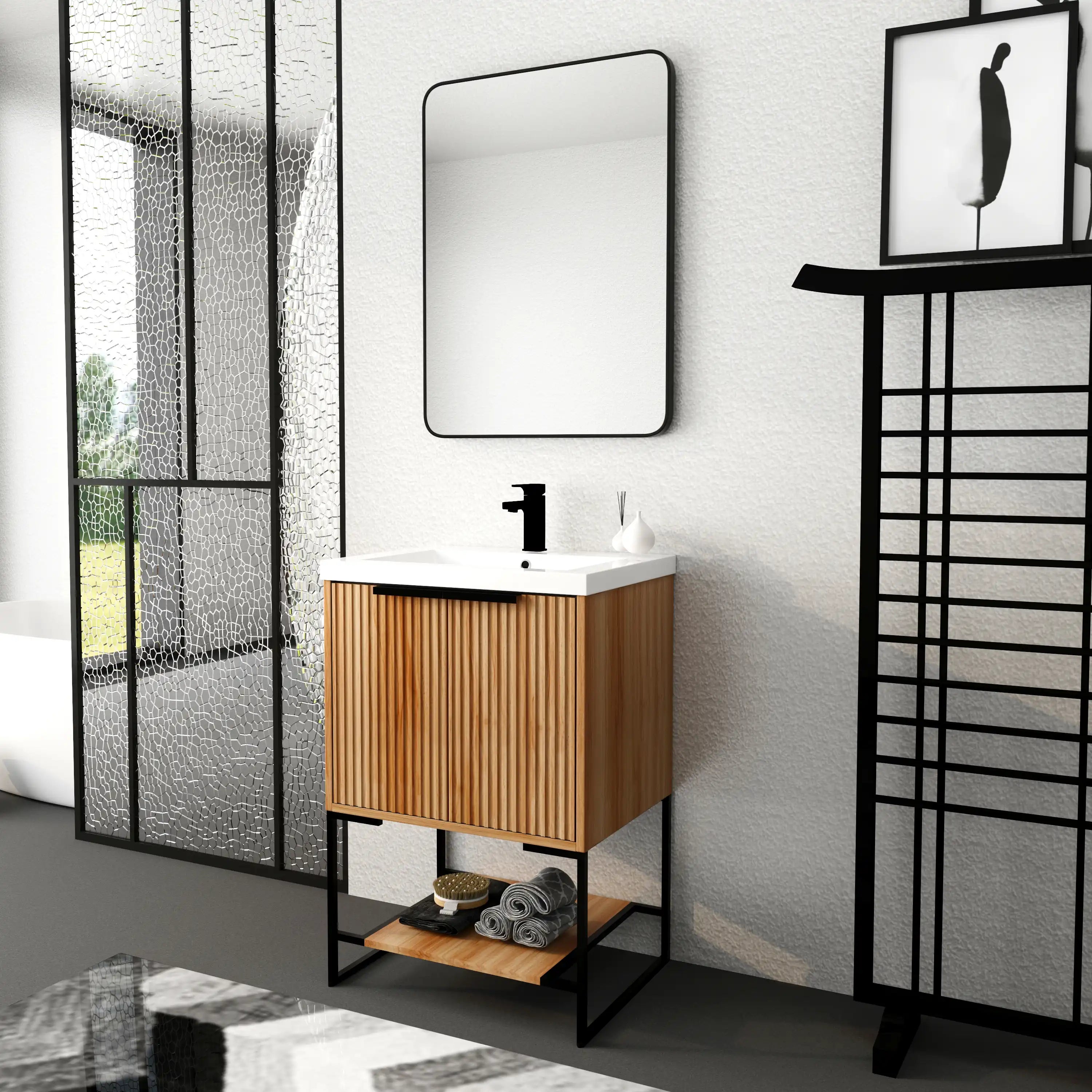 Freestanding 24 inch bathroom vanity with sink styled in bright bathroom with black fixtures.