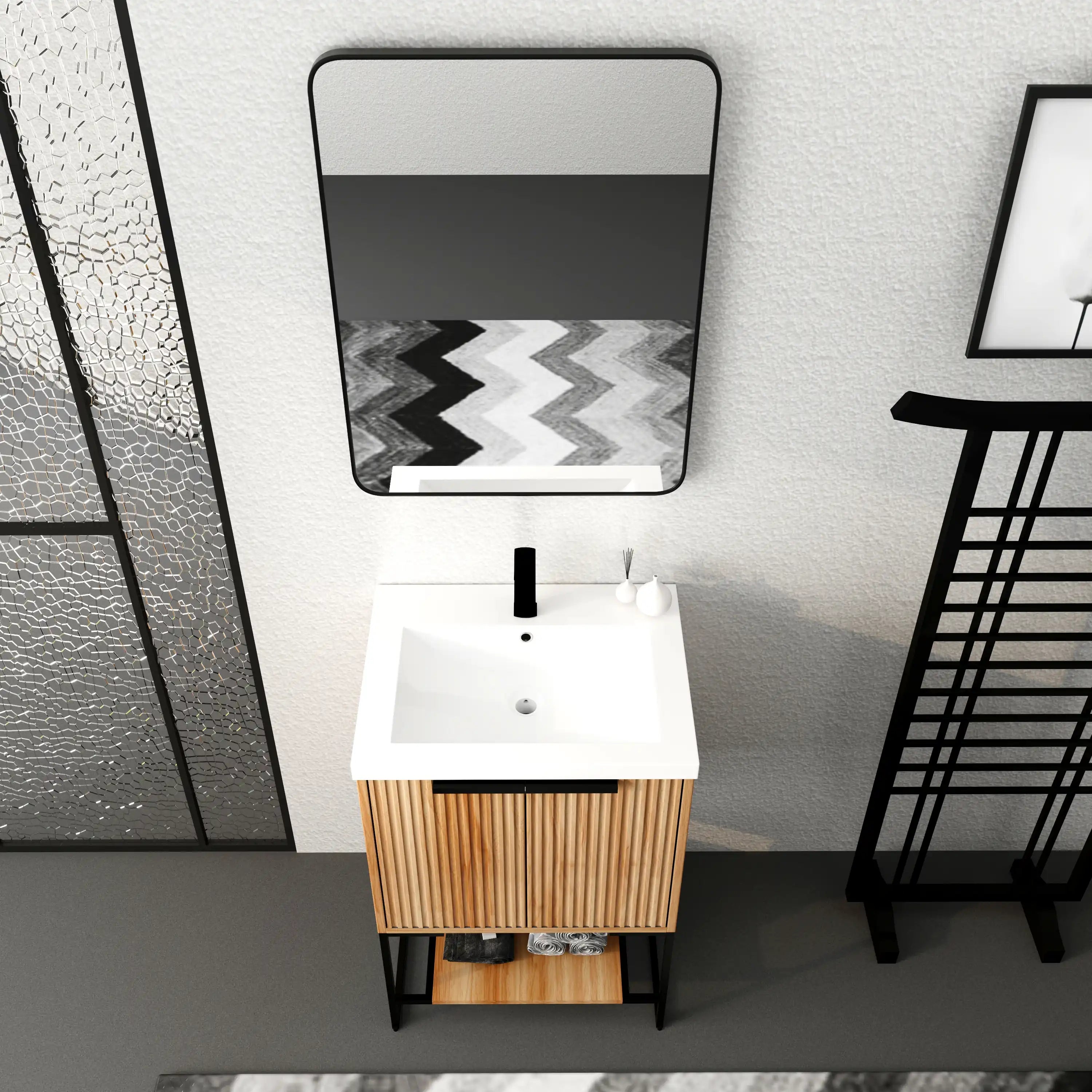 Freestanding 24 inch vanity with resin sink and black faucet, top view in modern bathroom setup.