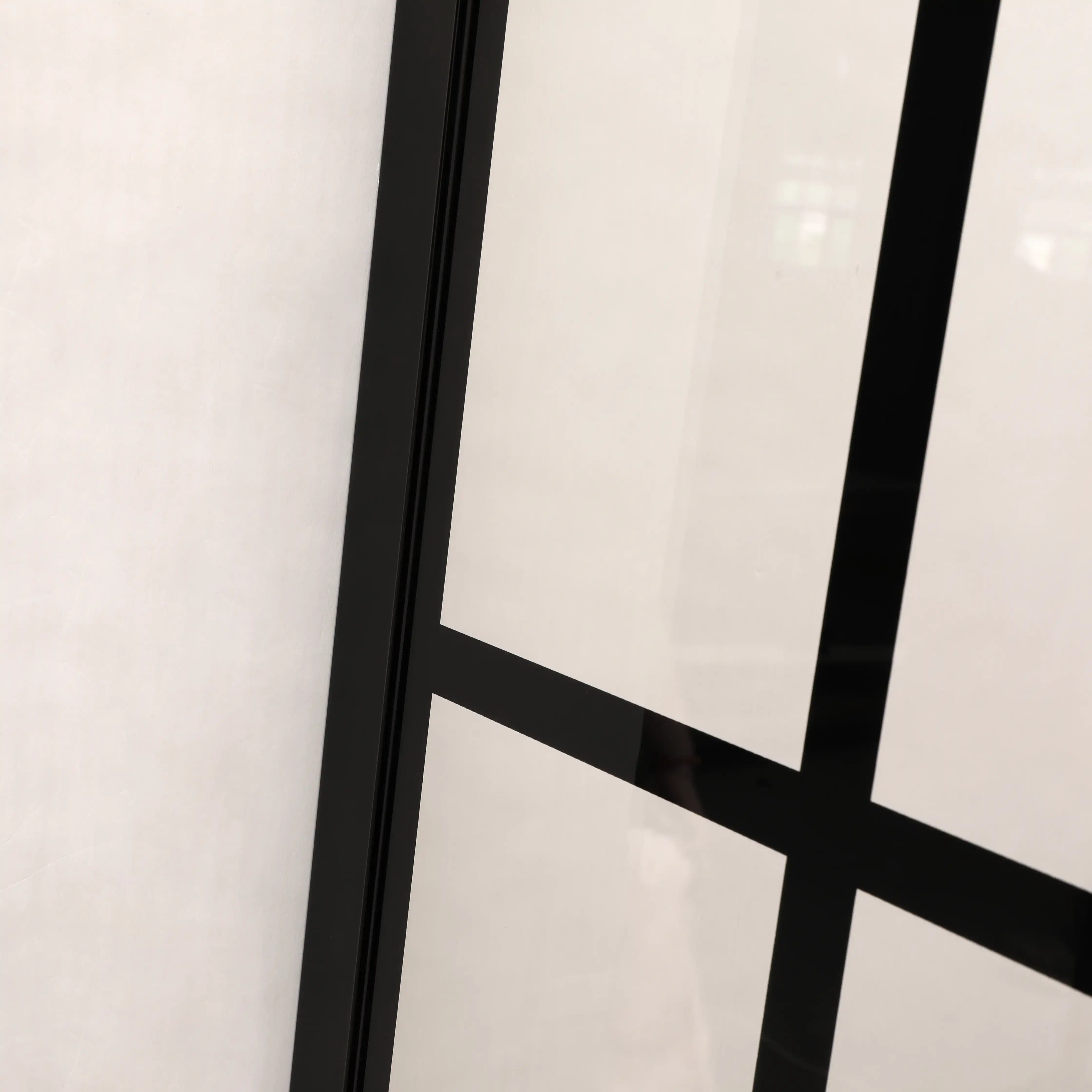 Frame detail of grid glass shower door 38 x 72 inch black finish.