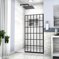 Bathroom interior with fixed shower door panel 34 x 72 inch black grid frame.