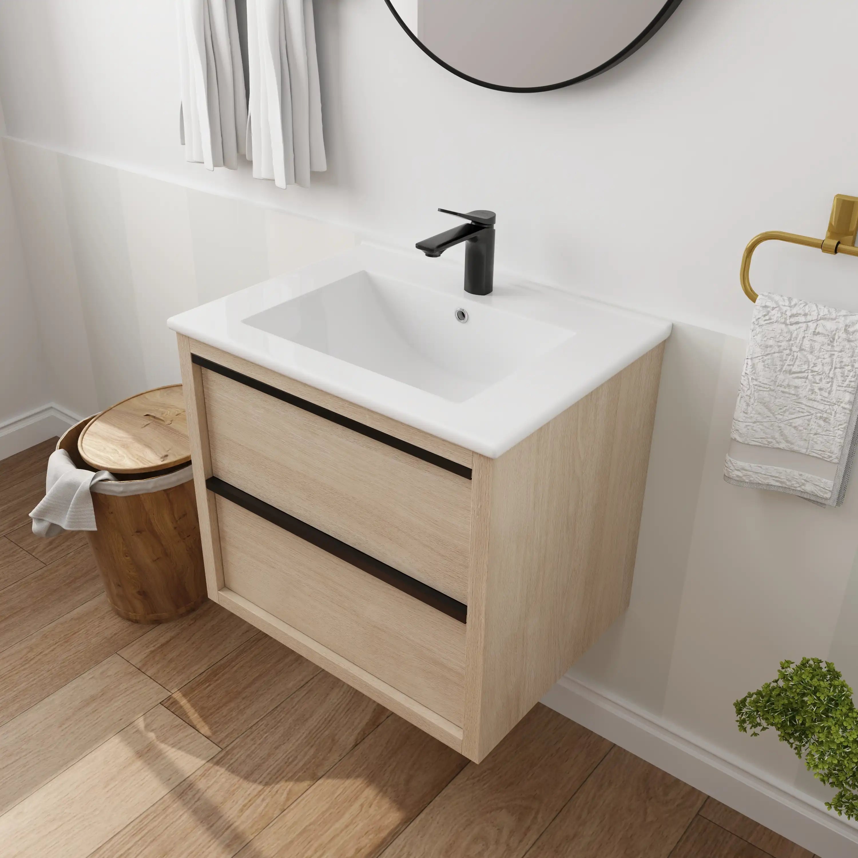 24" bathroom wall mount vanity in modern bathroom setting with light oak cabinet and black faucet.