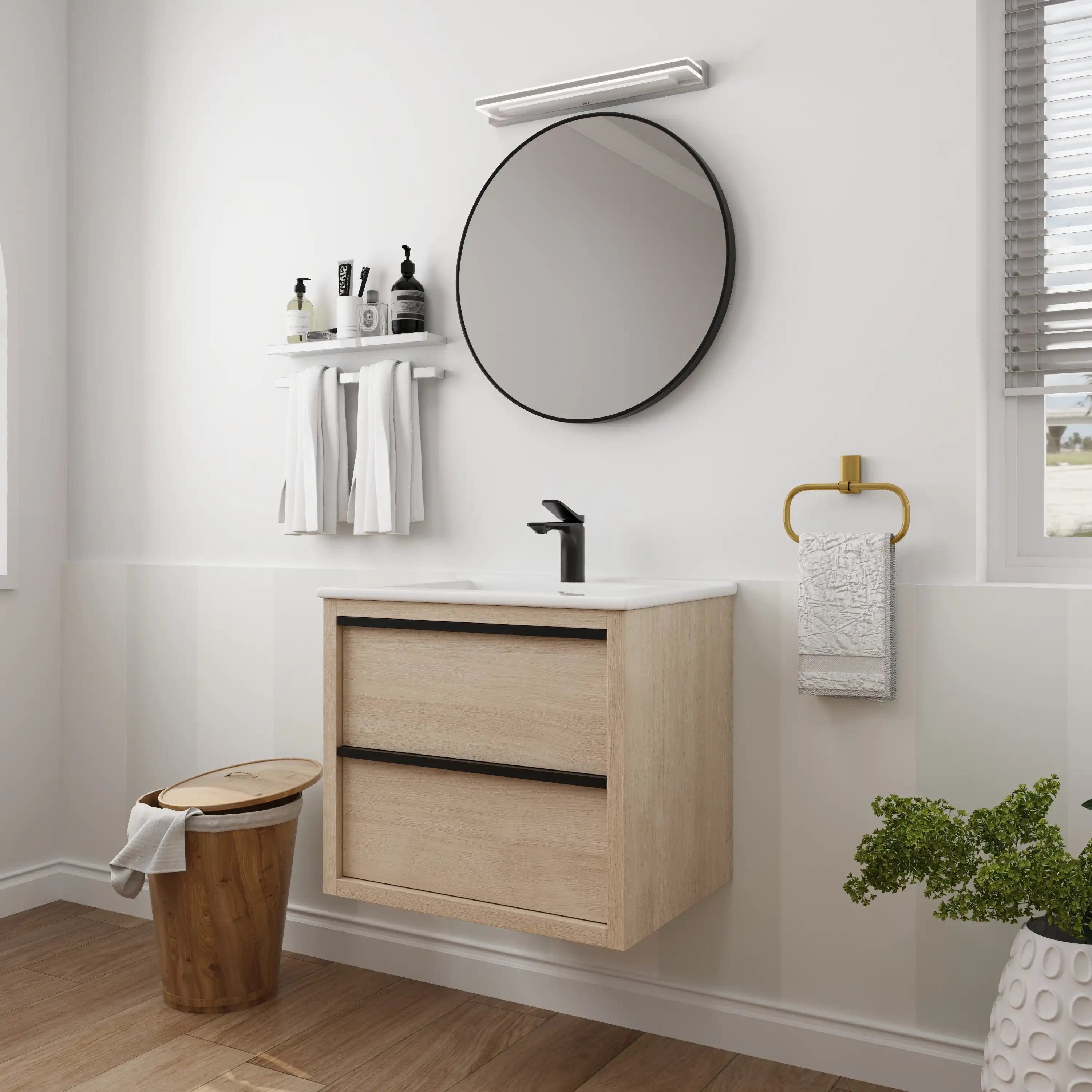 24" bathroom wall mount vanity styled with round mirror and black faucet in contemporary bathroom.
