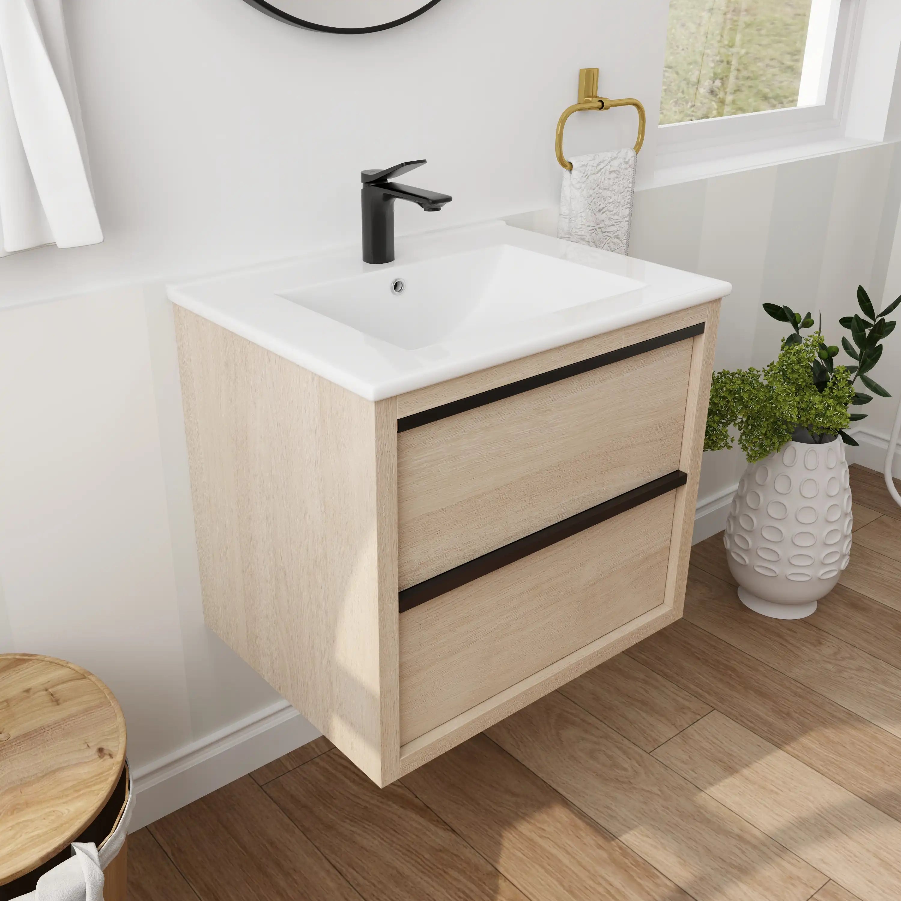 24" bathroom wall mount vanity with white integrated sink and light oak finish in modern bathroom setting.