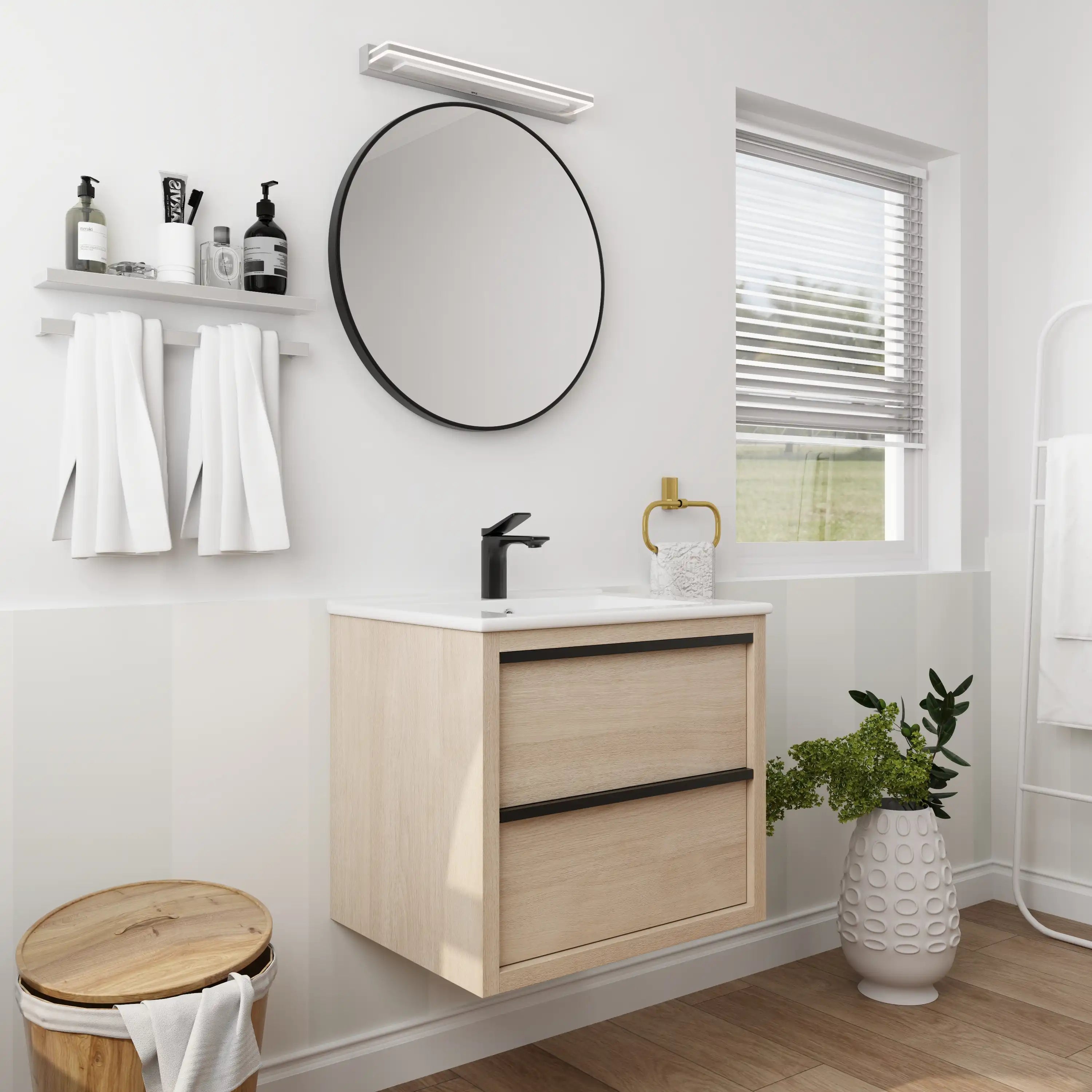 24" bathroom wall mount vanity in light oak with white sink, styled in modern bathroom interior.