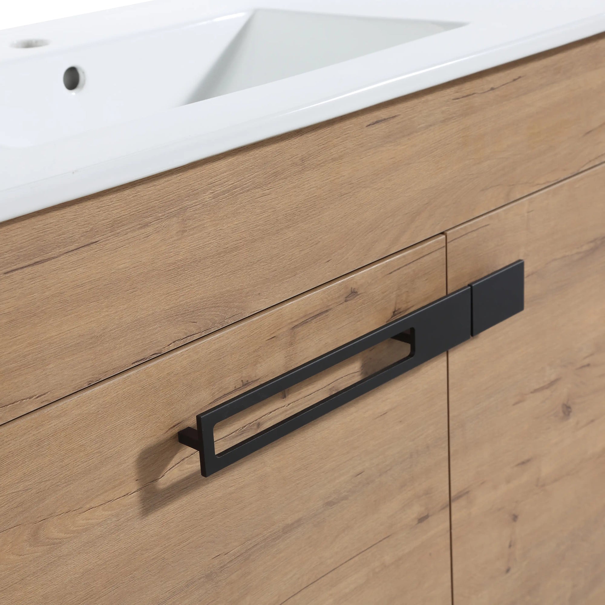 30" freestanding single bathroom vanity with sink detail showing oak finish cabinet, integrated white sink, and black metal handle | Ace Decor