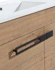 30" freestanding single bathroom vanity with sink detail showing oak finish cabinet, integrated white sink, and black metal handle | Ace Decor