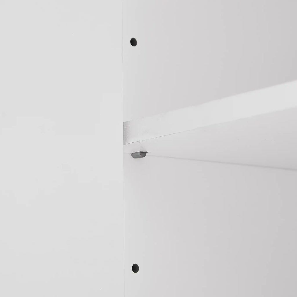 Close-up of adjustable shelf design inside white bathroom linen cabinet, showing customizable storage height.
