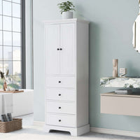 Tall white bathroom linen cabinet with doors and drawers in a modern bathroom setting.