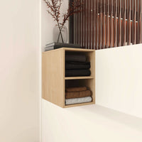 Light wood 12 inch wall-mounted open storage cabinet with shelves installed on bathroom wall, front view.