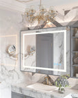 Optera 48-inch LED bathroom mirror installed in a modern vanity with magnifying mirror, marble countertop, and integrated storage.