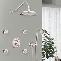 Avelar 9" brushed nickel rain shower set with 4 body jets and hand shower installed in a modern bathroom setting.