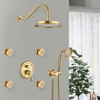 Luxury Avelar 9" brushed gold rain shower system with 4 body jets and hand shower installed in a modern bathroom.