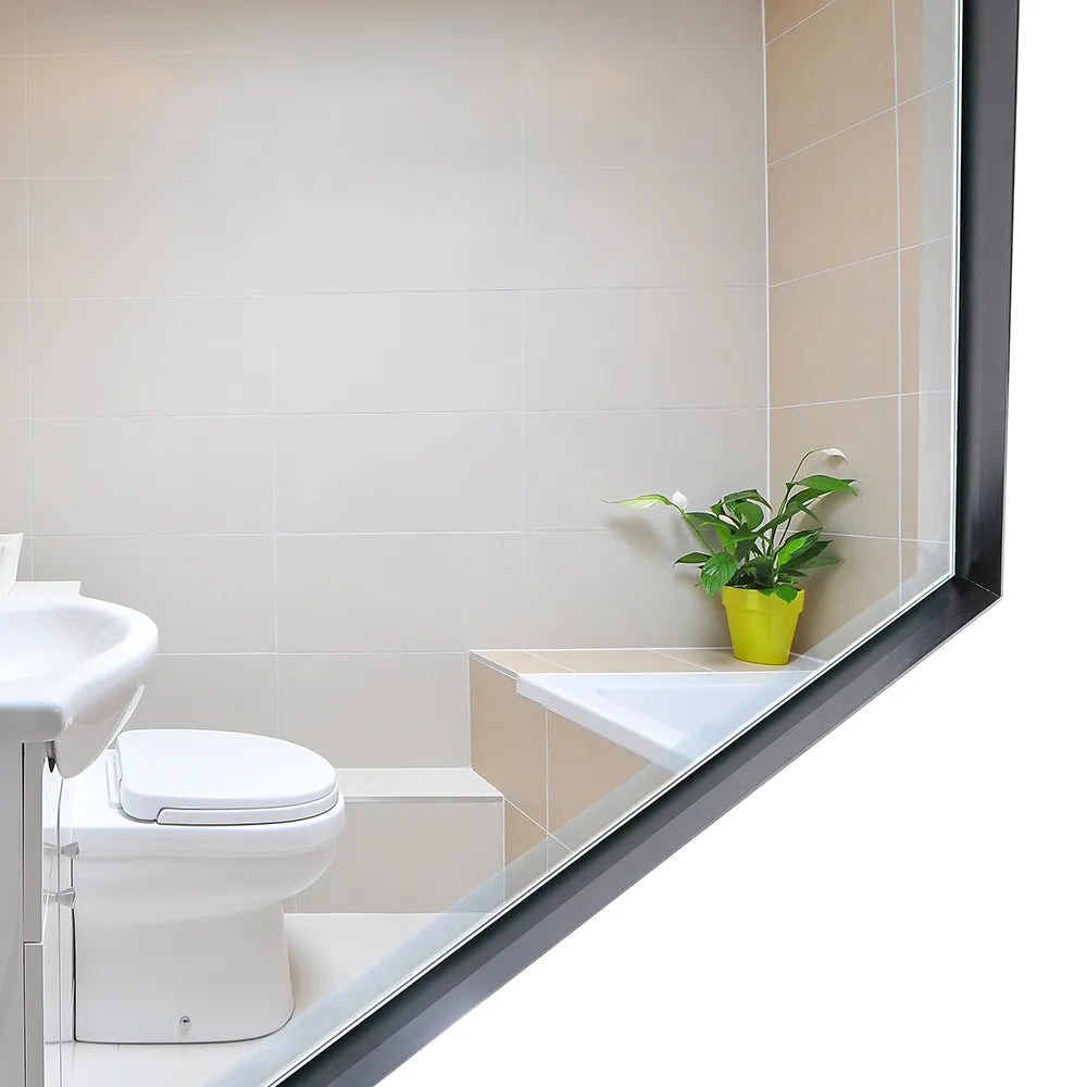 Noir Series black metal frame bathroom mirror on white background, highlighting its metal fram and beveled glass edge detail.