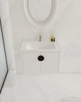 Bathroom scene featuring 28 inch small floating vanity with black handle option | Ace Decor