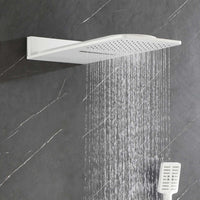 White rainfall shower head producing wide, full-body coverage spray.